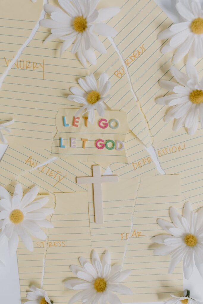 Uplifting Christian message with daisies, a cross, and motivational words against anxiety.